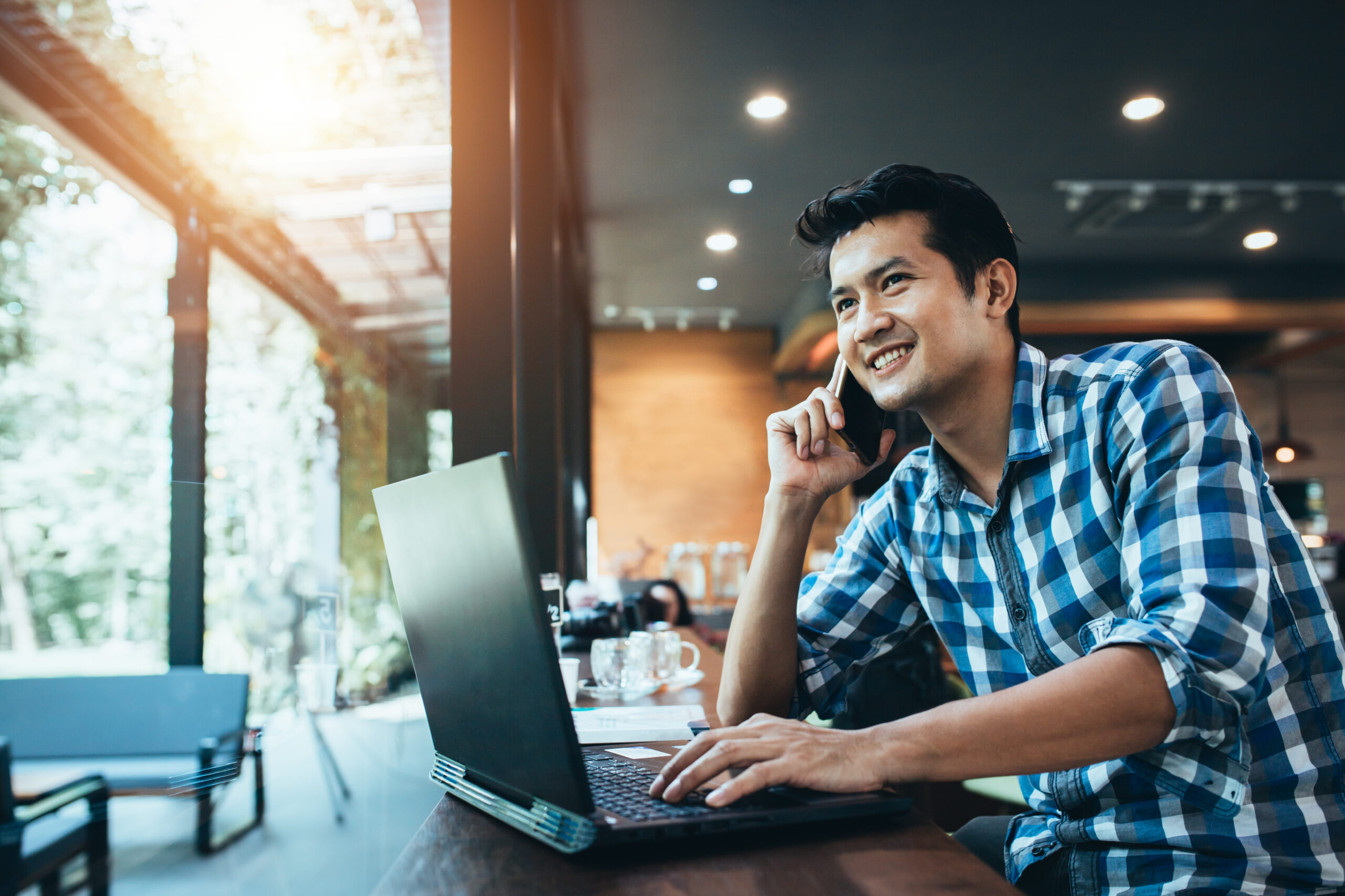 man in office using computer